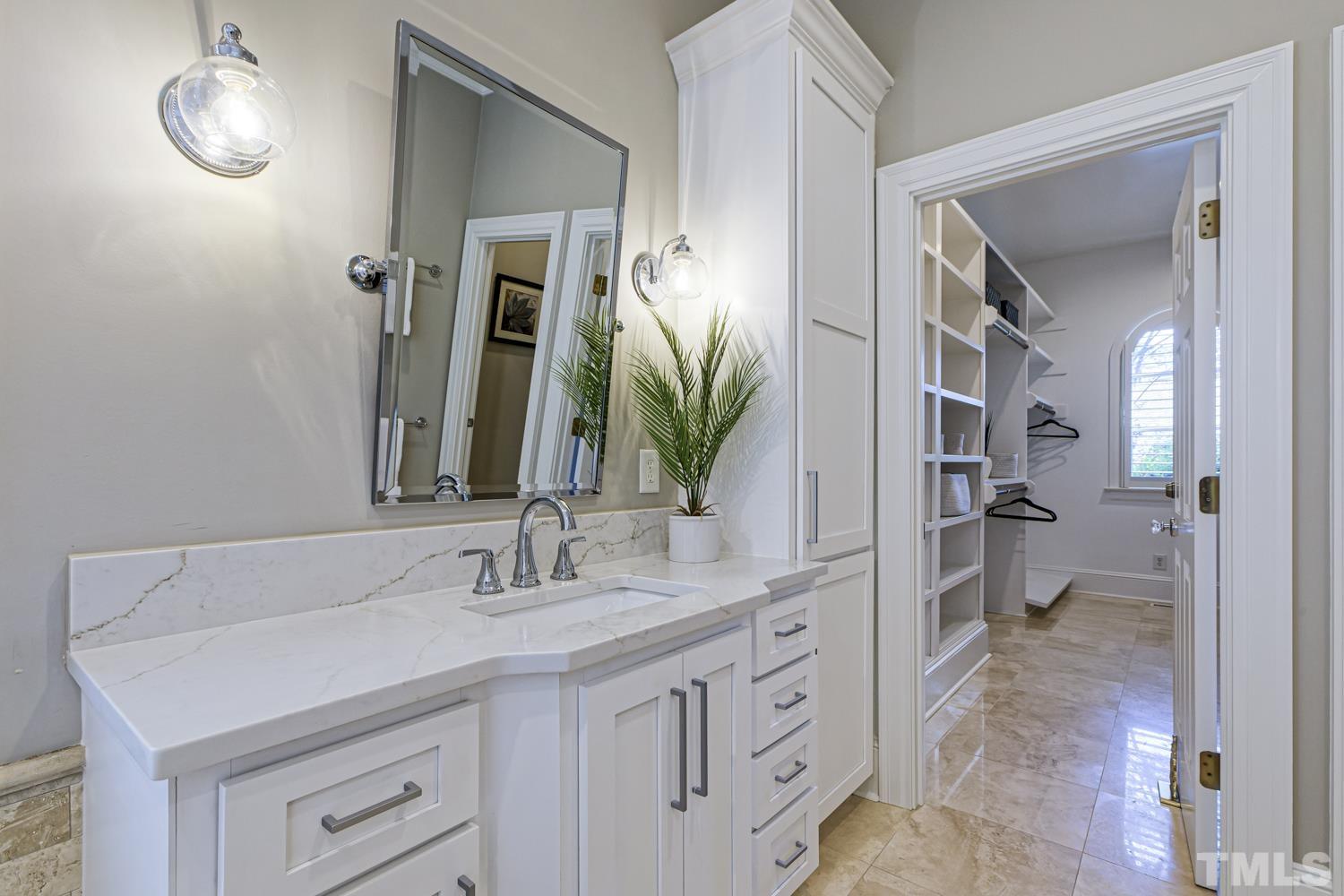 2642 Churchill Road Raleigh, NC 27608 - Photo 45 of 98 a bathroom with a double vanity sink and a mirror