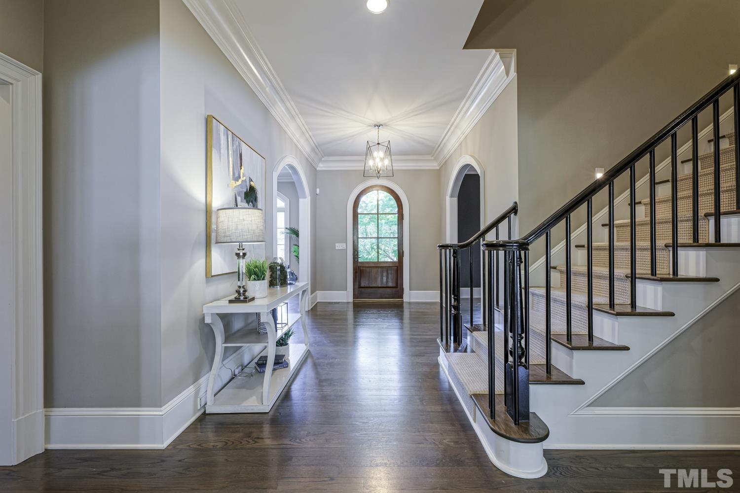 2642 Churchill Road Raleigh, NC 27608 - Photo 6 of 98 a view of entryway with wooden floor and stairs