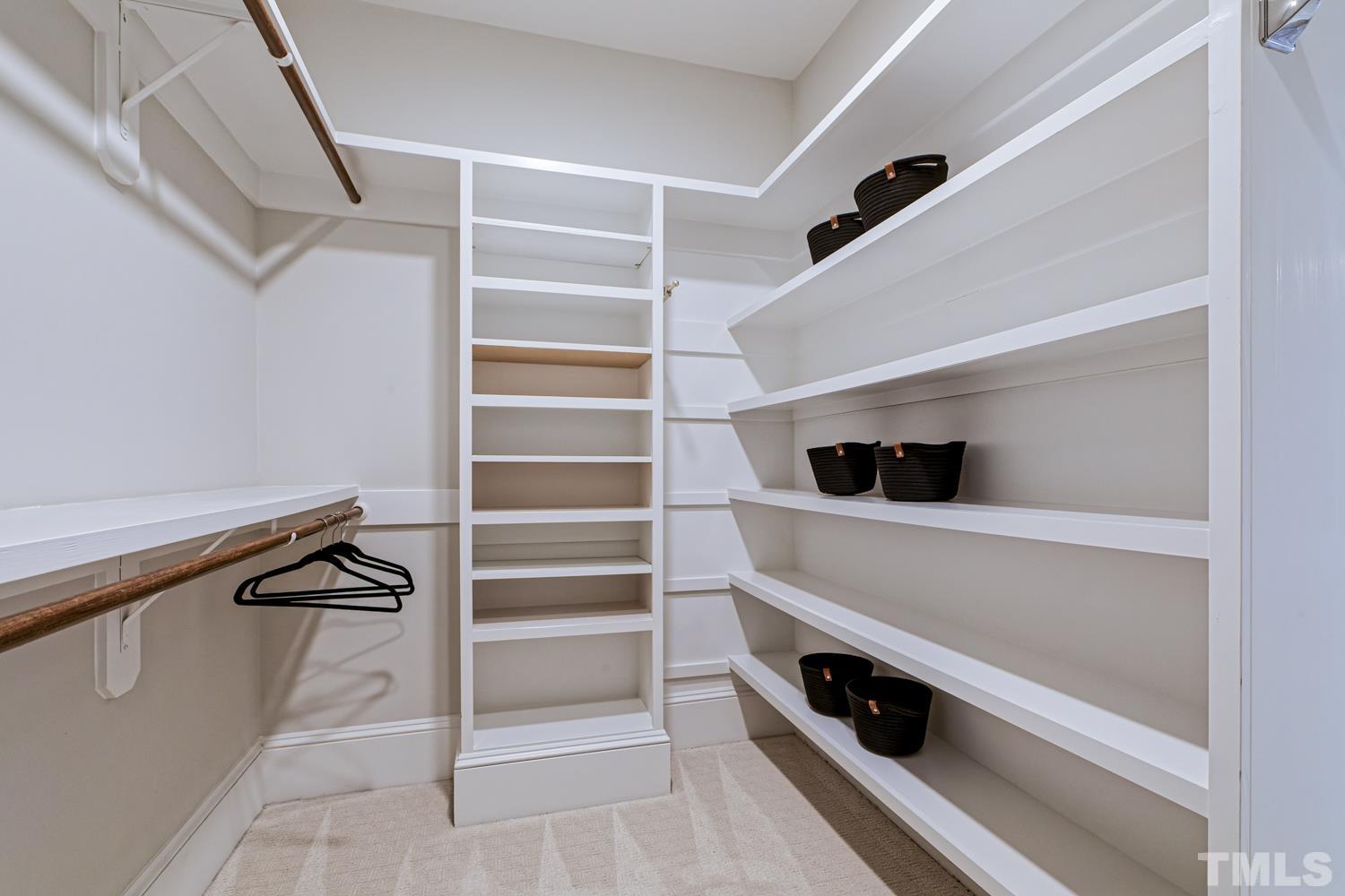 2642 Churchill Road Raleigh, NC 27608 - Photo 64 of 98 a view of walk in closet with empty racks