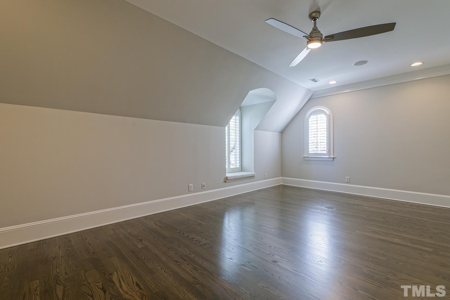 2642 Churchill Road Raleigh, NC 27608 - Photo 65 of 98 an empty room with wooden floor and windows