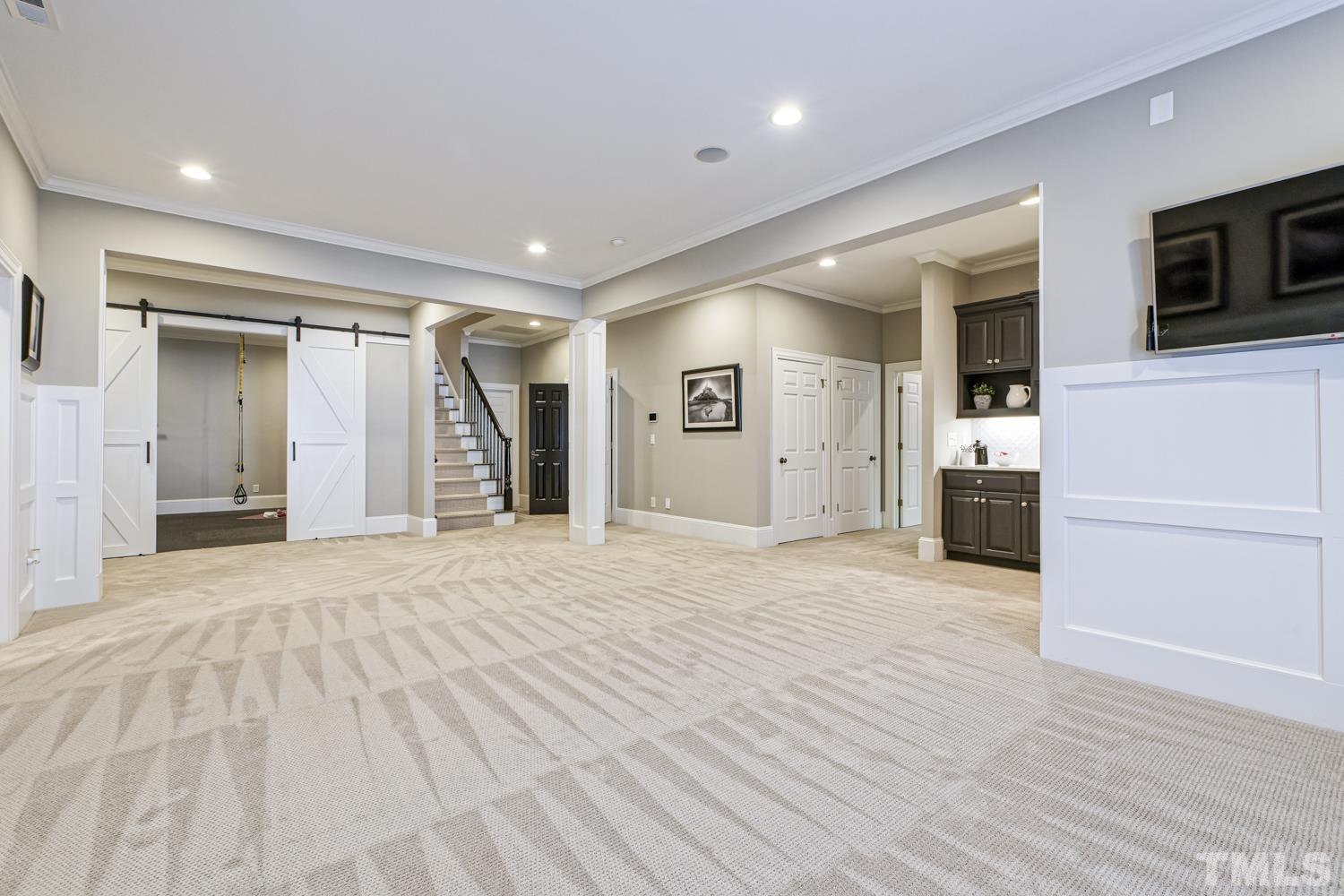 2642 Churchill Road Raleigh, NC 27608 - Photo 81 of 98 a view of a livingroom with an empty space and a kitchen