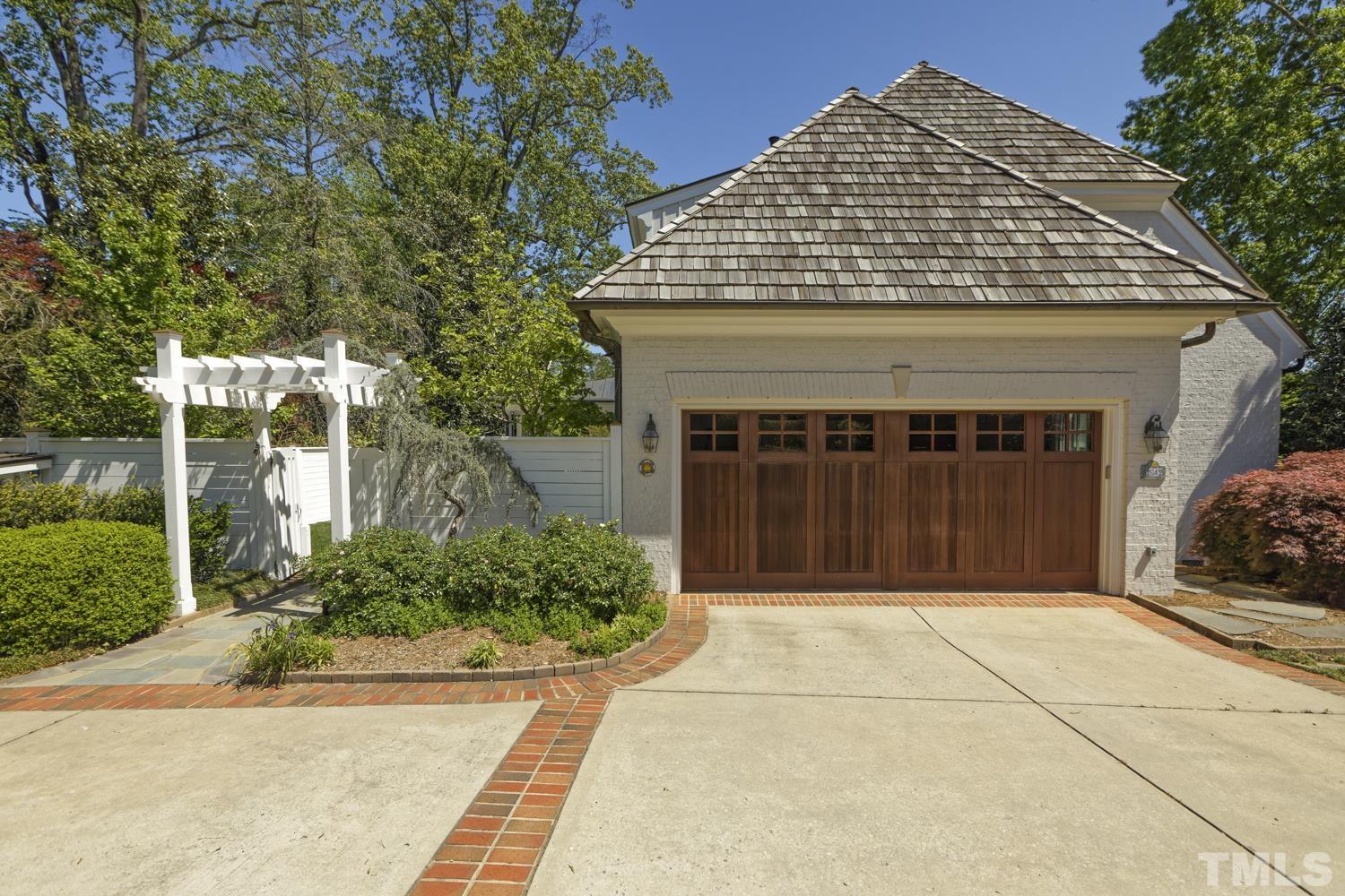 2642 Churchill Road Raleigh, NC 27608 - Photo 83 of 98 a front view of a house with a garden