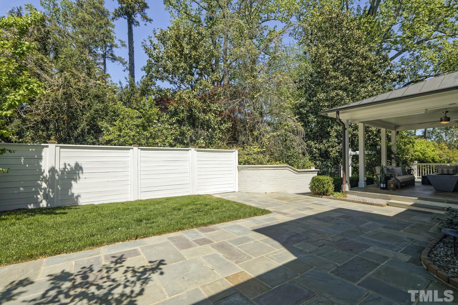 2642 Churchill Road Raleigh, NC 27608 - Photo 85 of 98 a view of a backyard with plants and large tree