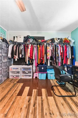 a view of a room with clothes and shoes