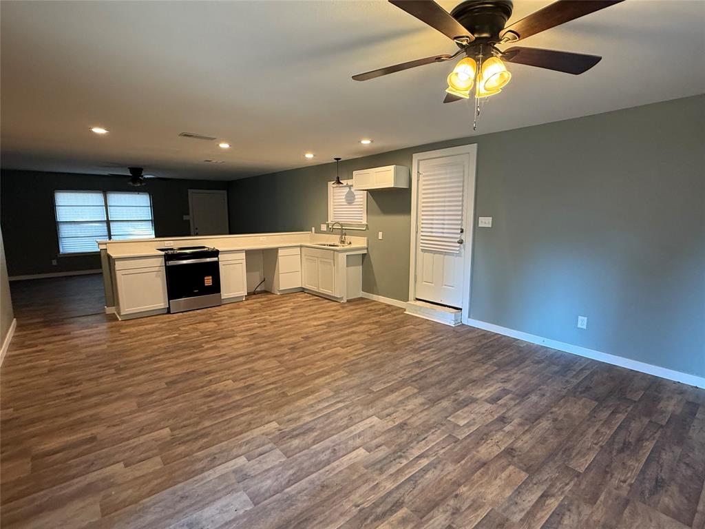 606 Colonial Drive Athens, TX 75751 - Photo 12 of 12 a view of kitchen with kitchen island microwave and stove