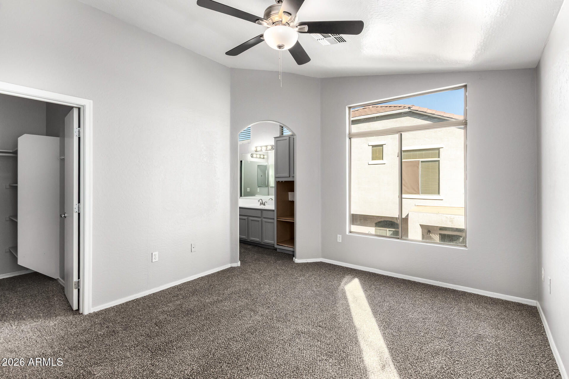 2150 East Bell Road, Unit 1075 Phoenix, AZ 85022 - Photo 20 of 45 a view of a big room with windows and chandelier fan