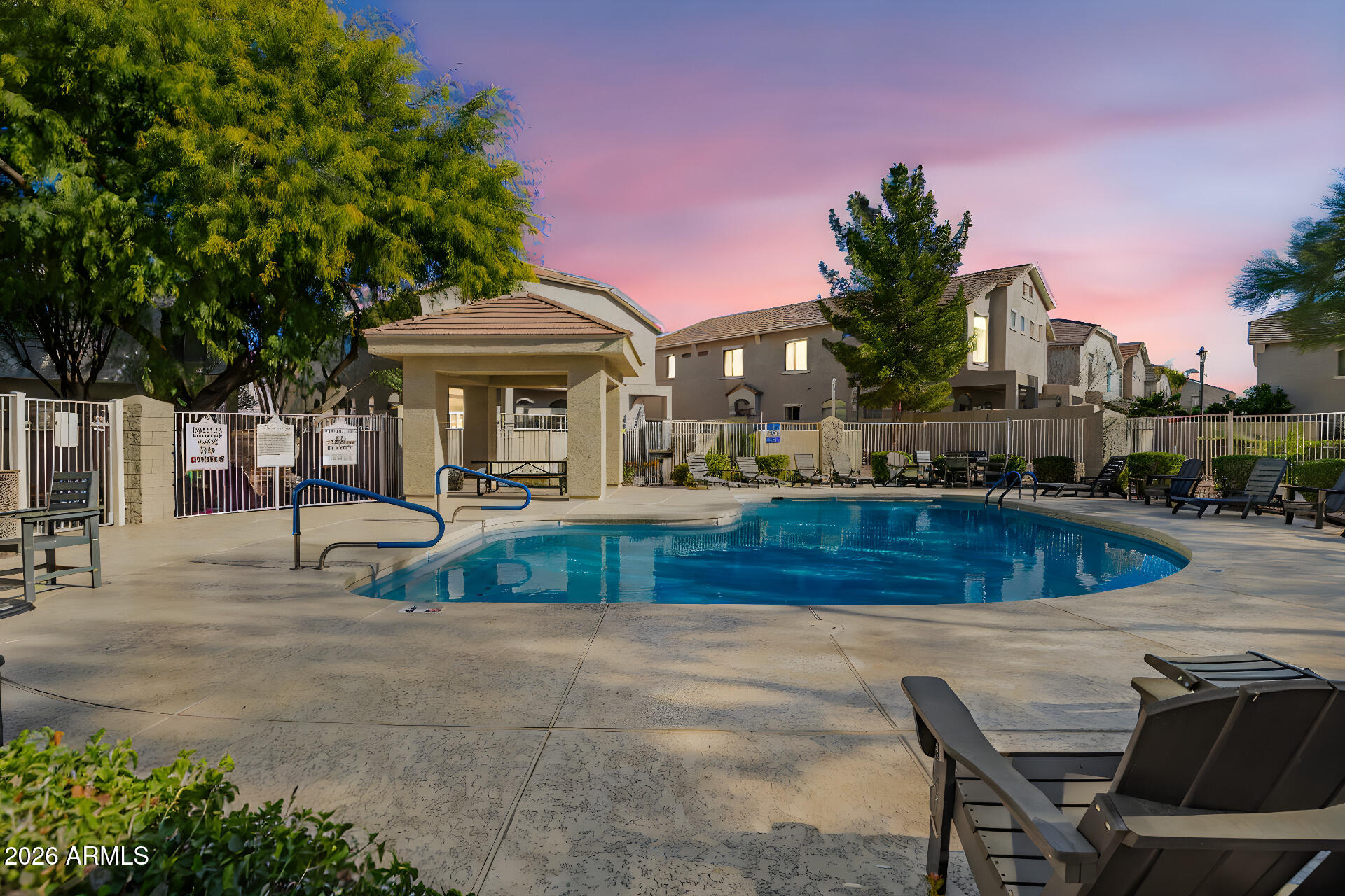 2150 East Bell Road, Unit 1075 Phoenix, AZ 85022 - Photo 2 of 45 a view of a house with pool and a yard