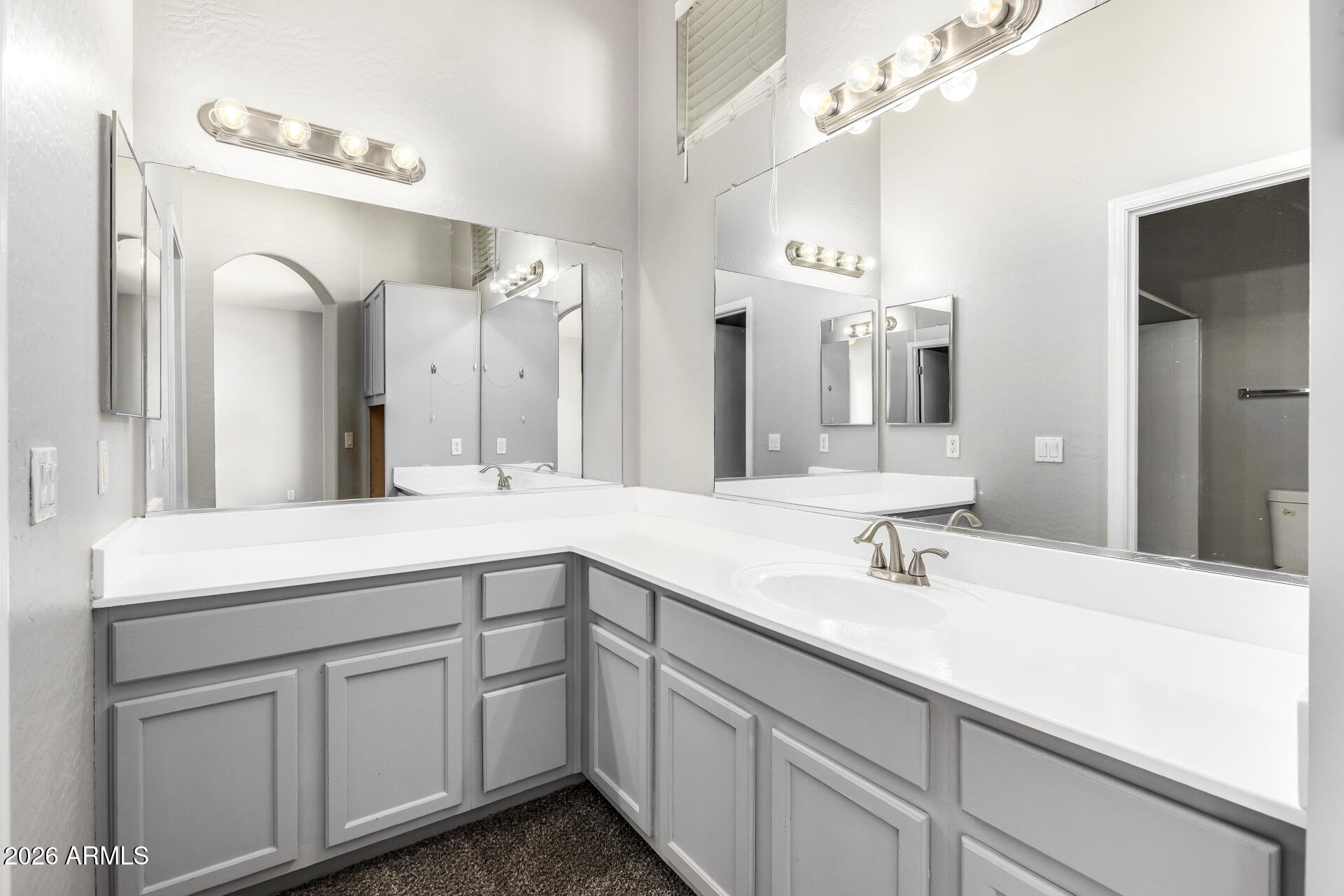 2150 East Bell Road, Unit 1075 Phoenix, AZ 85022 - Photo 21 of 45 a bathroom with a sink and a mirror