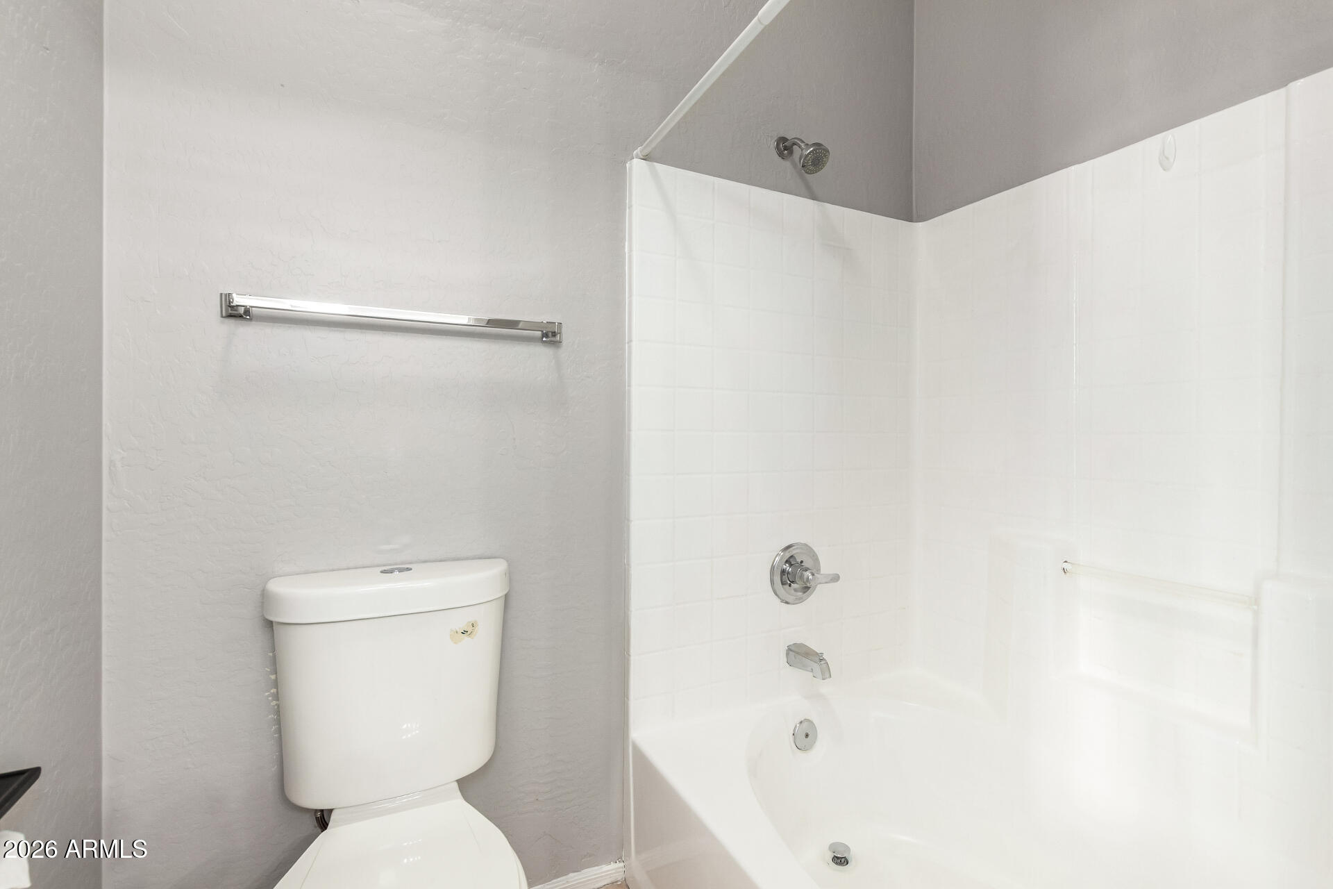 2150 East Bell Road, Unit 1075 Phoenix, AZ 85022 - Photo 22 of 45 a white toilet sitting next to a bath tub
