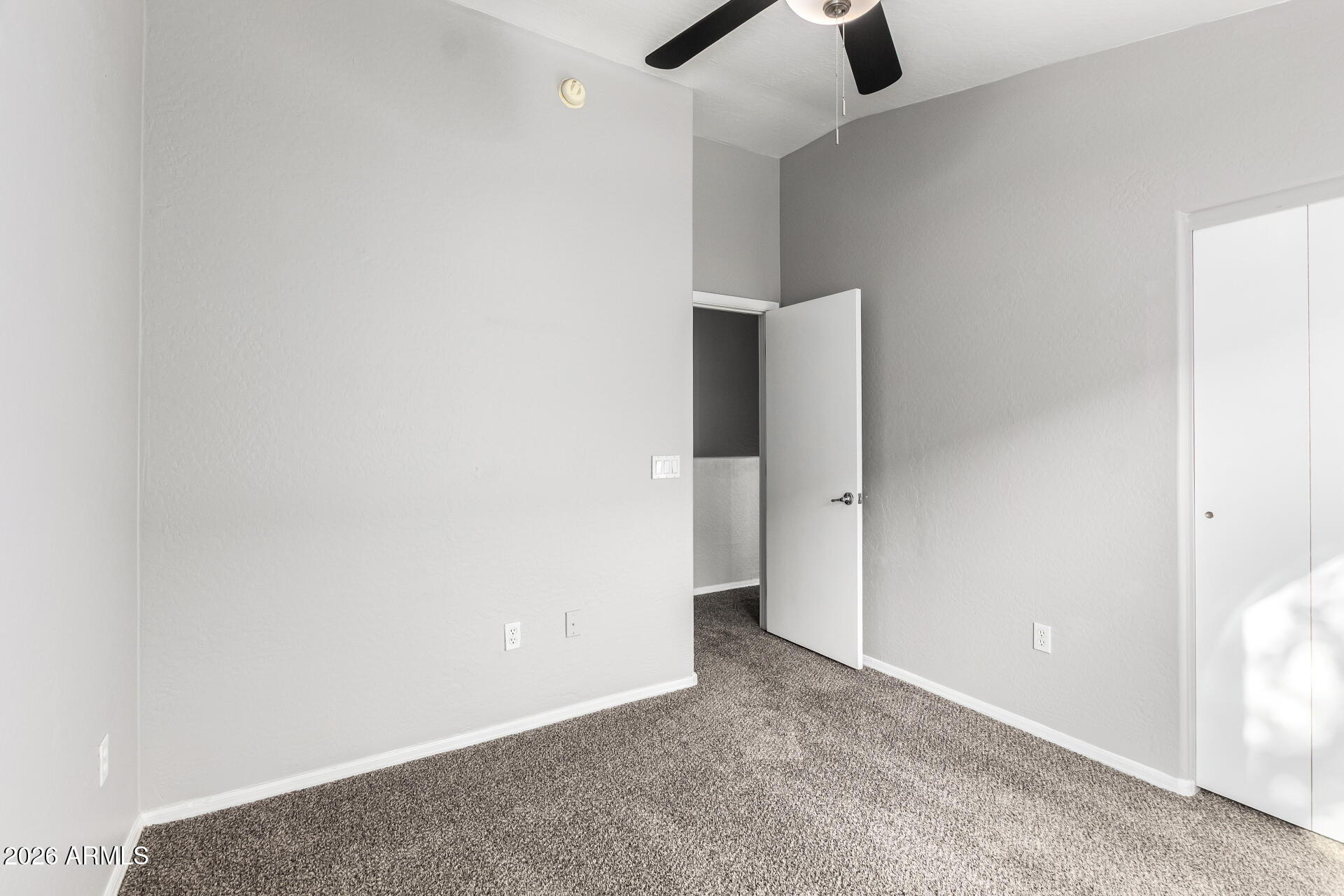 2150 East Bell Road, Unit 1075 Phoenix, AZ 85022 - Photo 26 of 45 an empty room with view of entryway