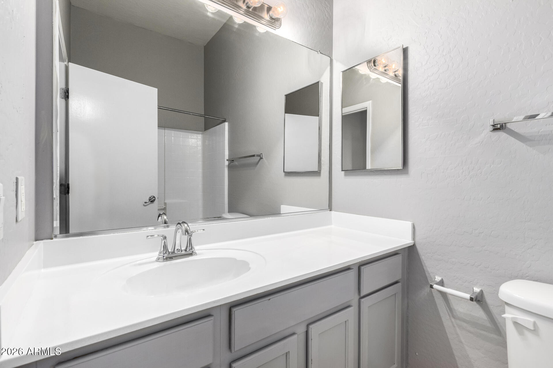 2150 East Bell Road, Unit 1075 Phoenix, AZ 85022 - Photo 27 of 45 a bathroom with a sink and a mirror