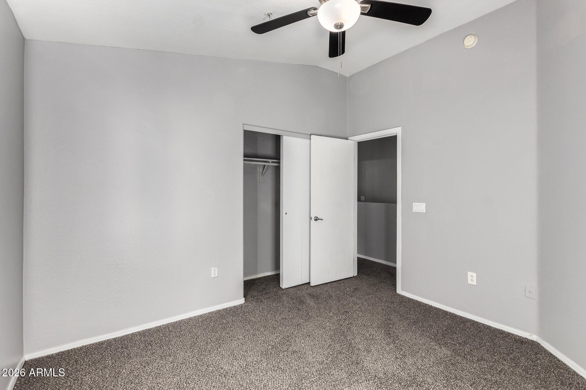 2150 East Bell Road, Unit 1075 Phoenix, AZ 85022 - Photo 29 of 45 an empty room with a empty space and a ceiling fan
