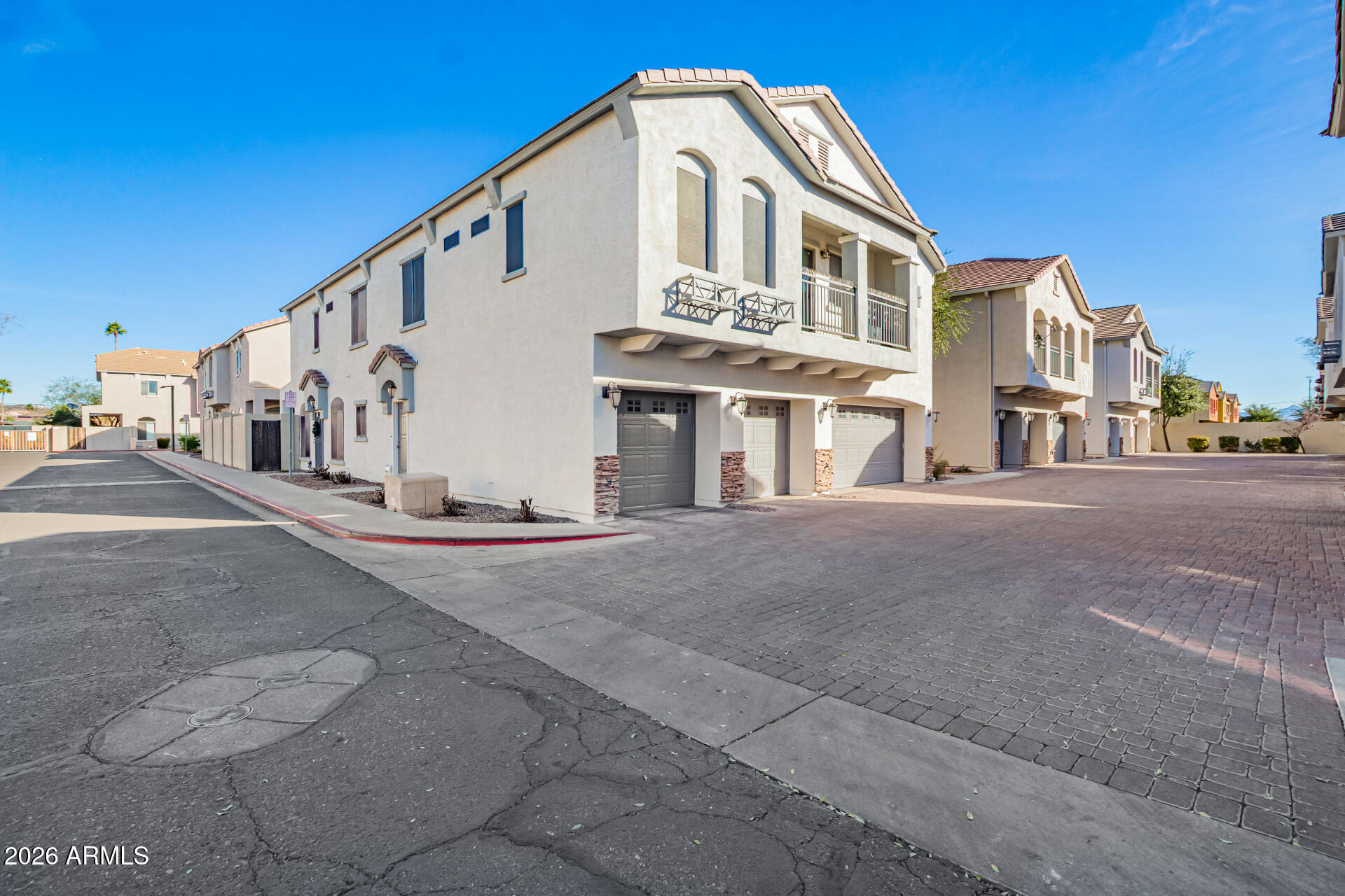 2150 East Bell Road, Unit 1075 Phoenix, AZ 85022 - Photo 3 of 45 a view of a building with a street