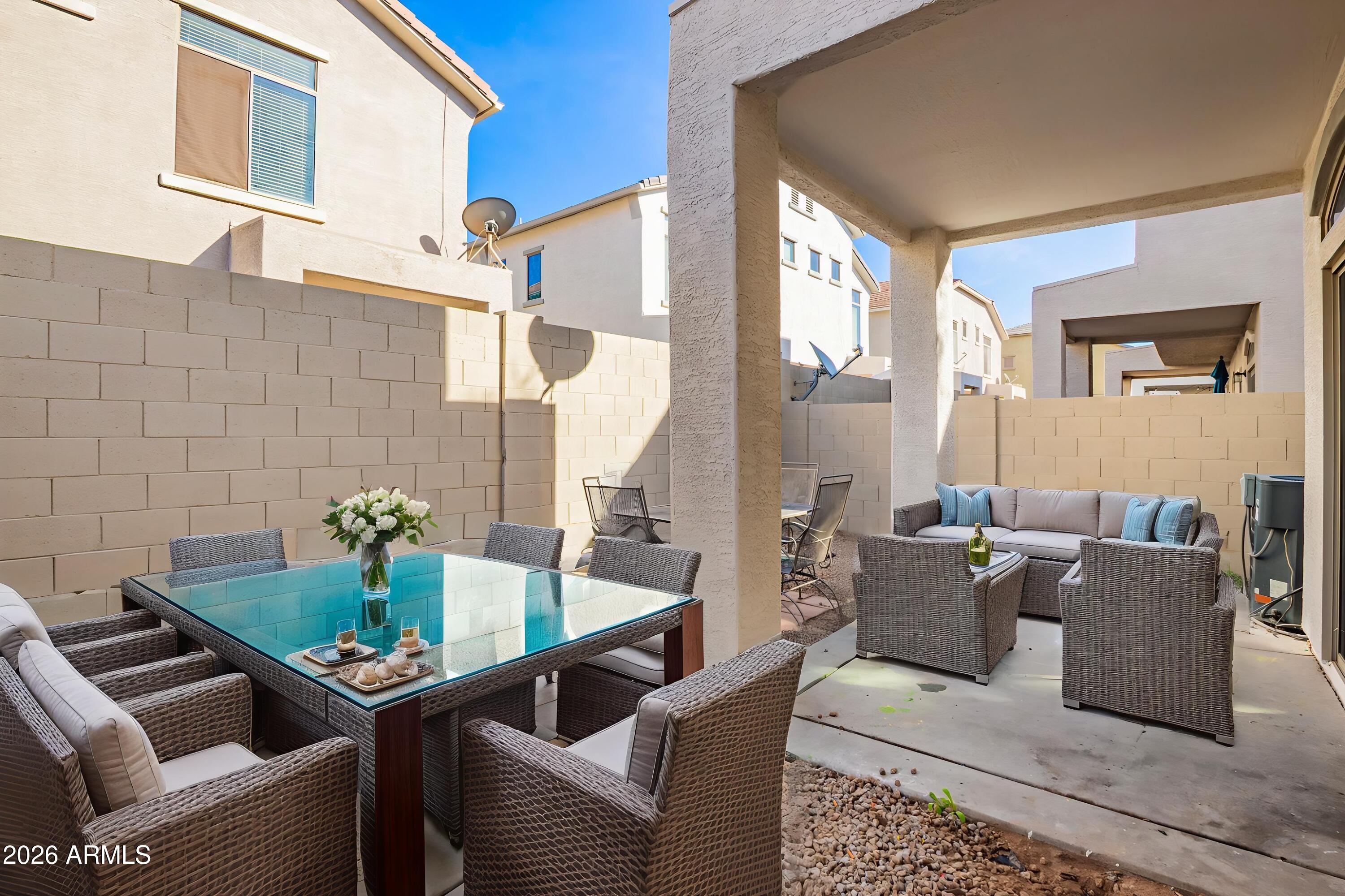 2150 East Bell Road, Unit 1075 Phoenix, AZ 85022 - Photo 35 of 45 a living room with furniture and a potted plant