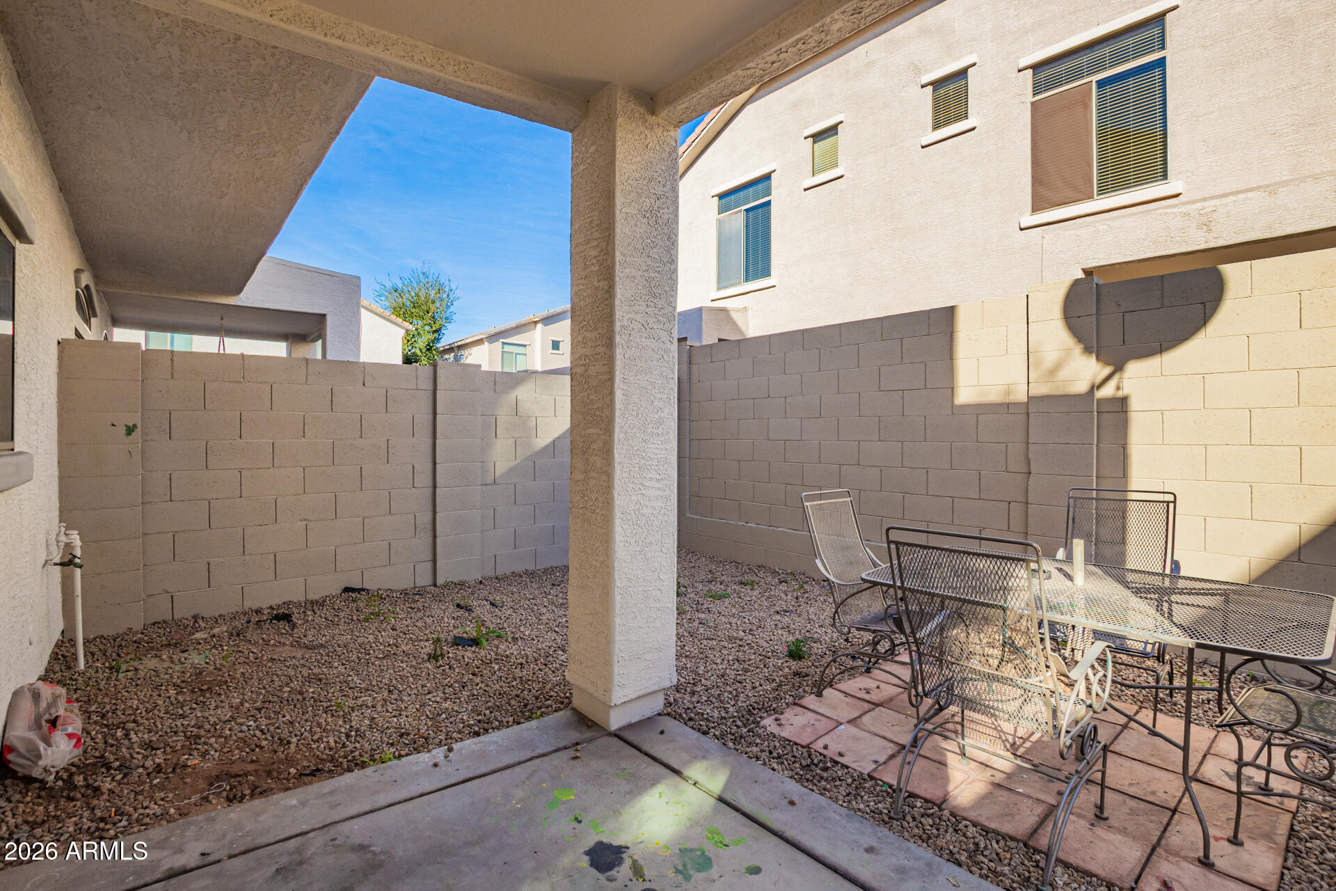 2150 East Bell Road, Unit 1075 Phoenix, AZ 85022 - Photo 36 of 45 a view of a door and chair in the patio