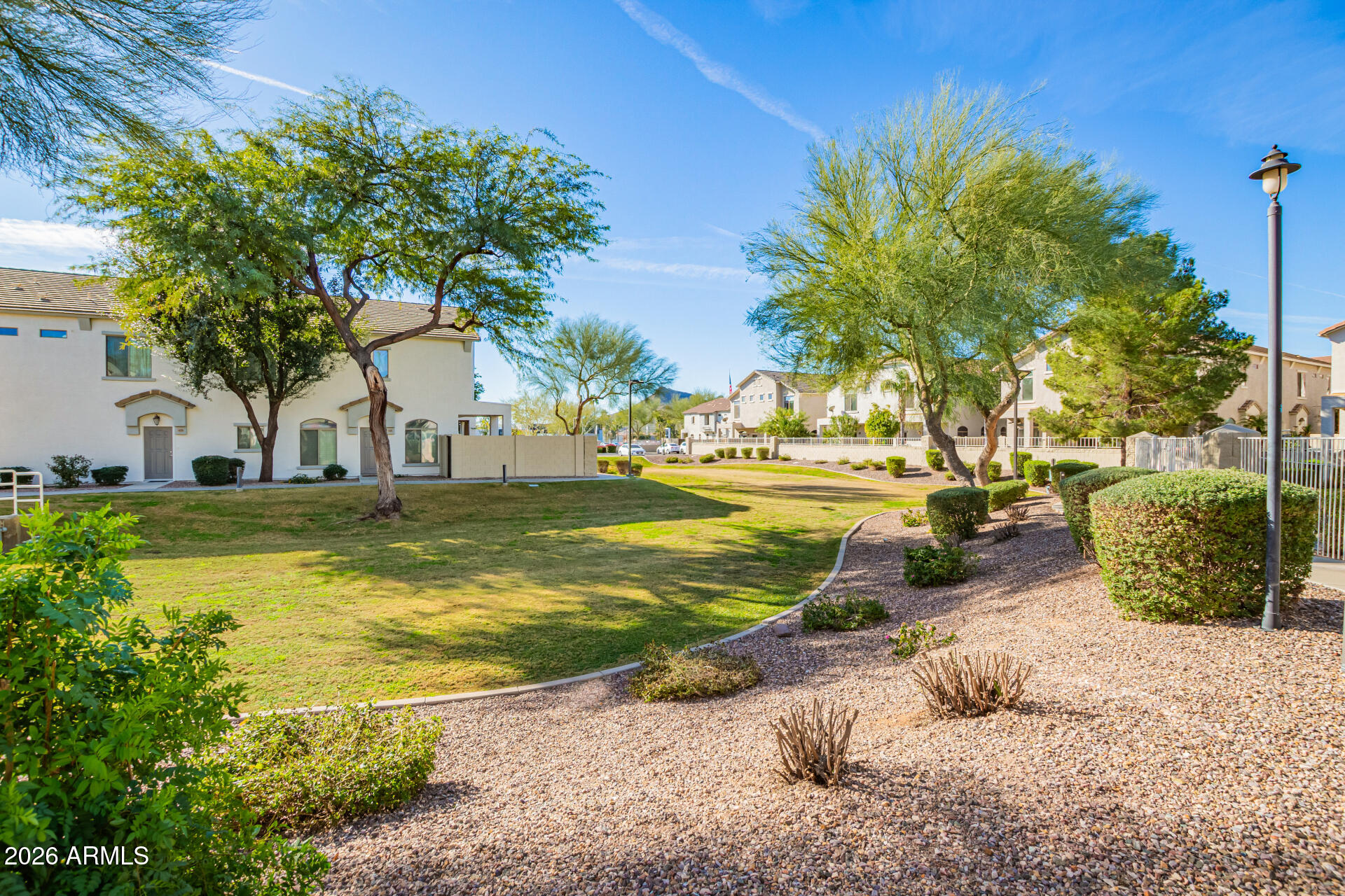 2150 East Bell Road, Unit 1075 Phoenix, AZ 85022 - Photo 44 of 45 a view of a swimming pool with a lawn chairs