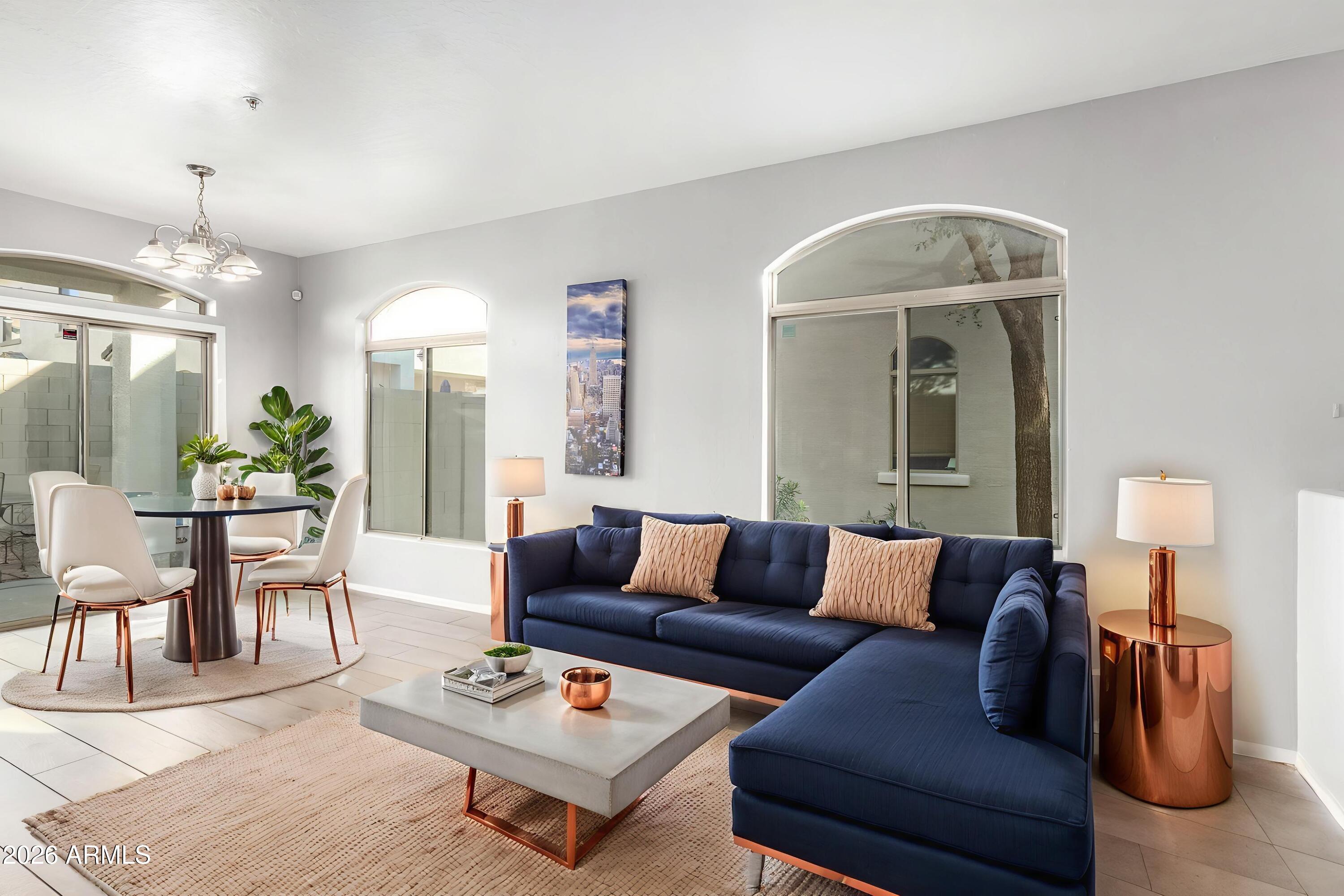 2150 East Bell Road, Unit 1075 Phoenix, AZ 85022 - Photo 7 of 45 a living room with furniture and wooden floor