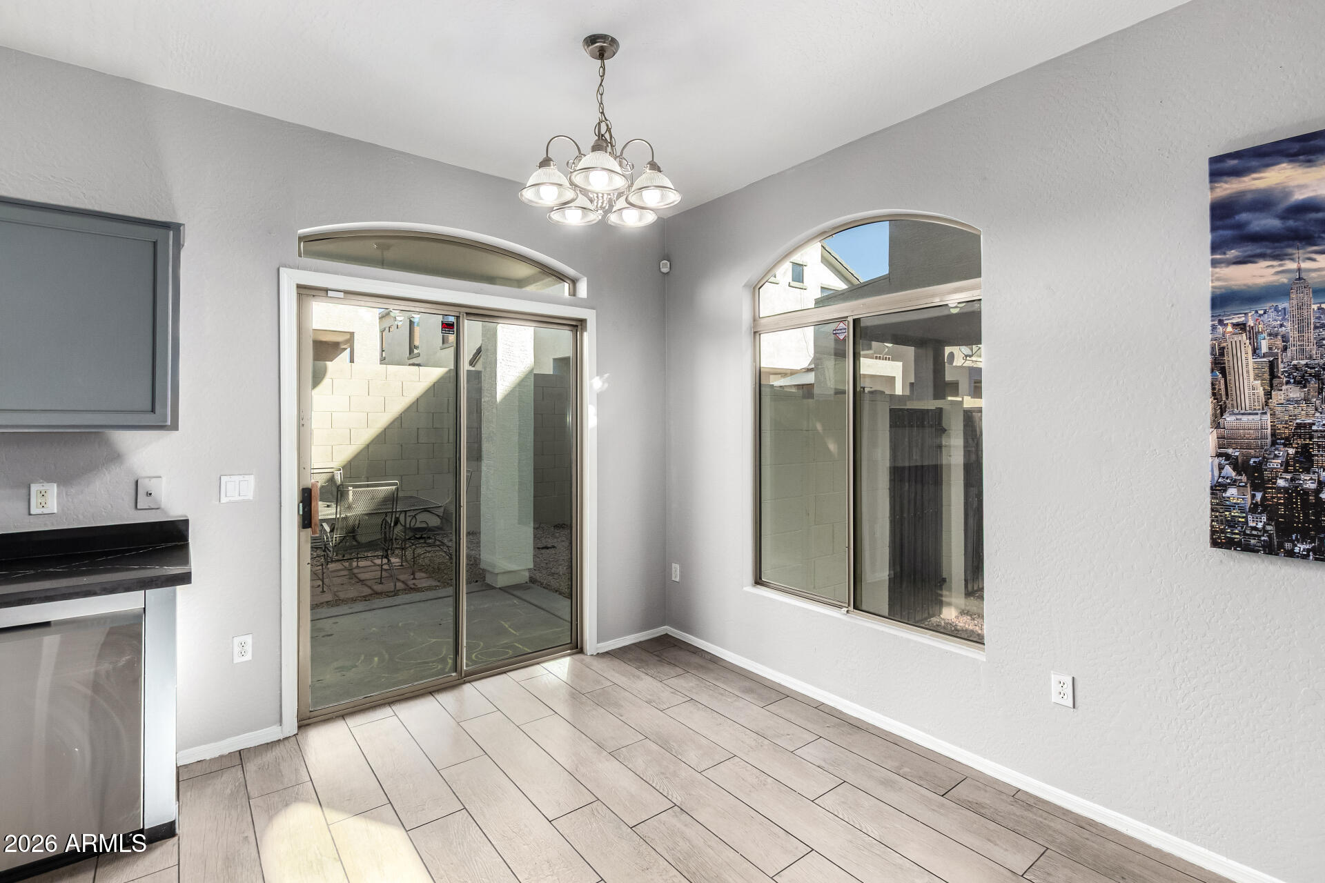 2150 East Bell Road, Unit 1075 Phoenix, AZ 85022 - Photo 10 of 45 a view of a hallway with windows and chandelier