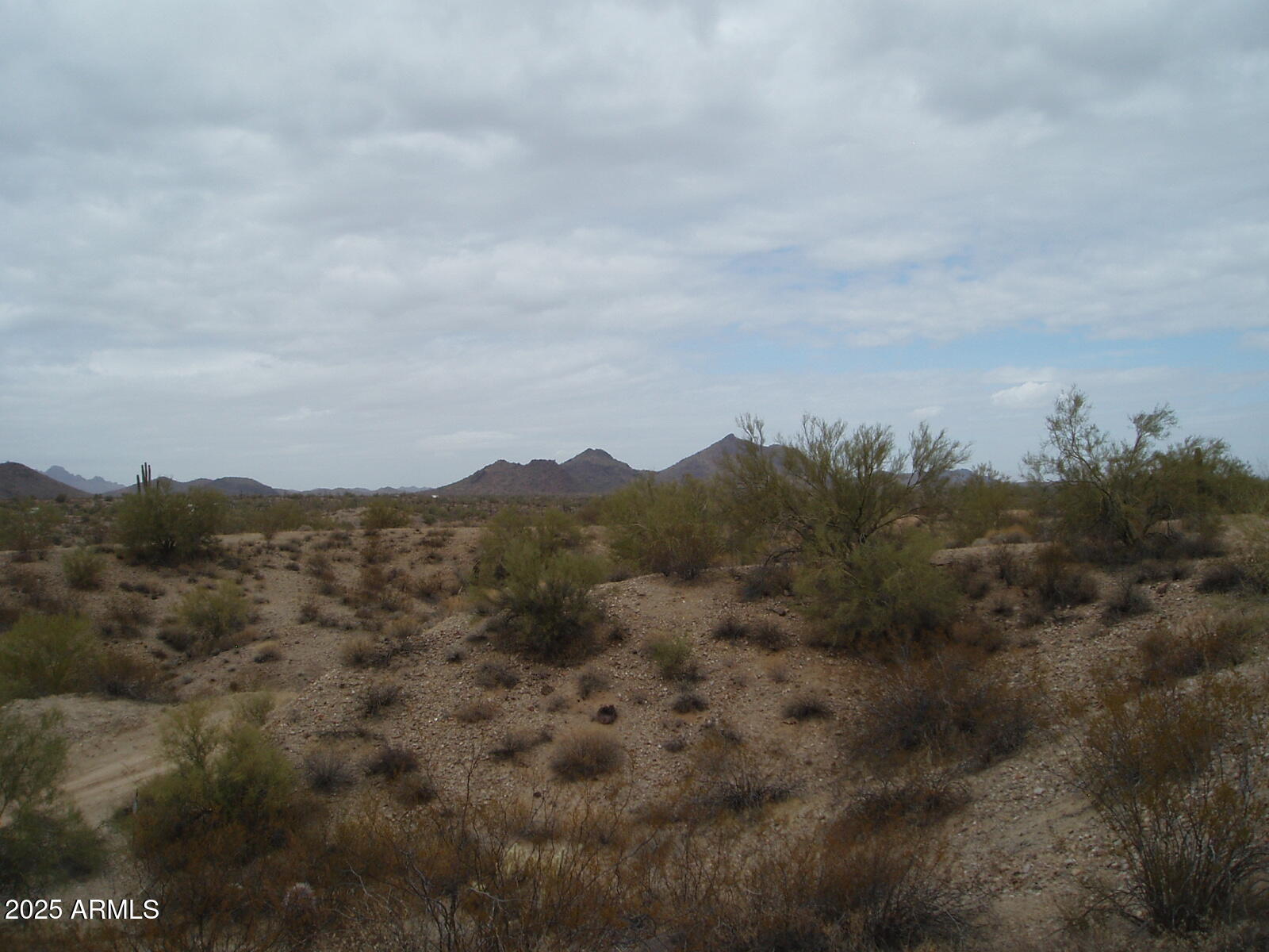 28700 West Dove Valley Road, Unit 6 PARCELS Wittmann, AZ 85361 - Photo 4 of 11 an aerial view of houses covered in trees
