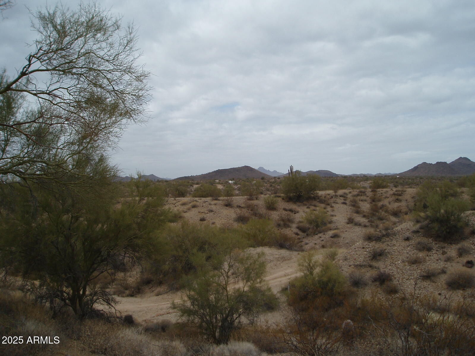 28700 West Dove Valley Road, Unit 6 PARCELS Wittmann, AZ 85361 - Photo 5 of 11 a view of a houses with a yard