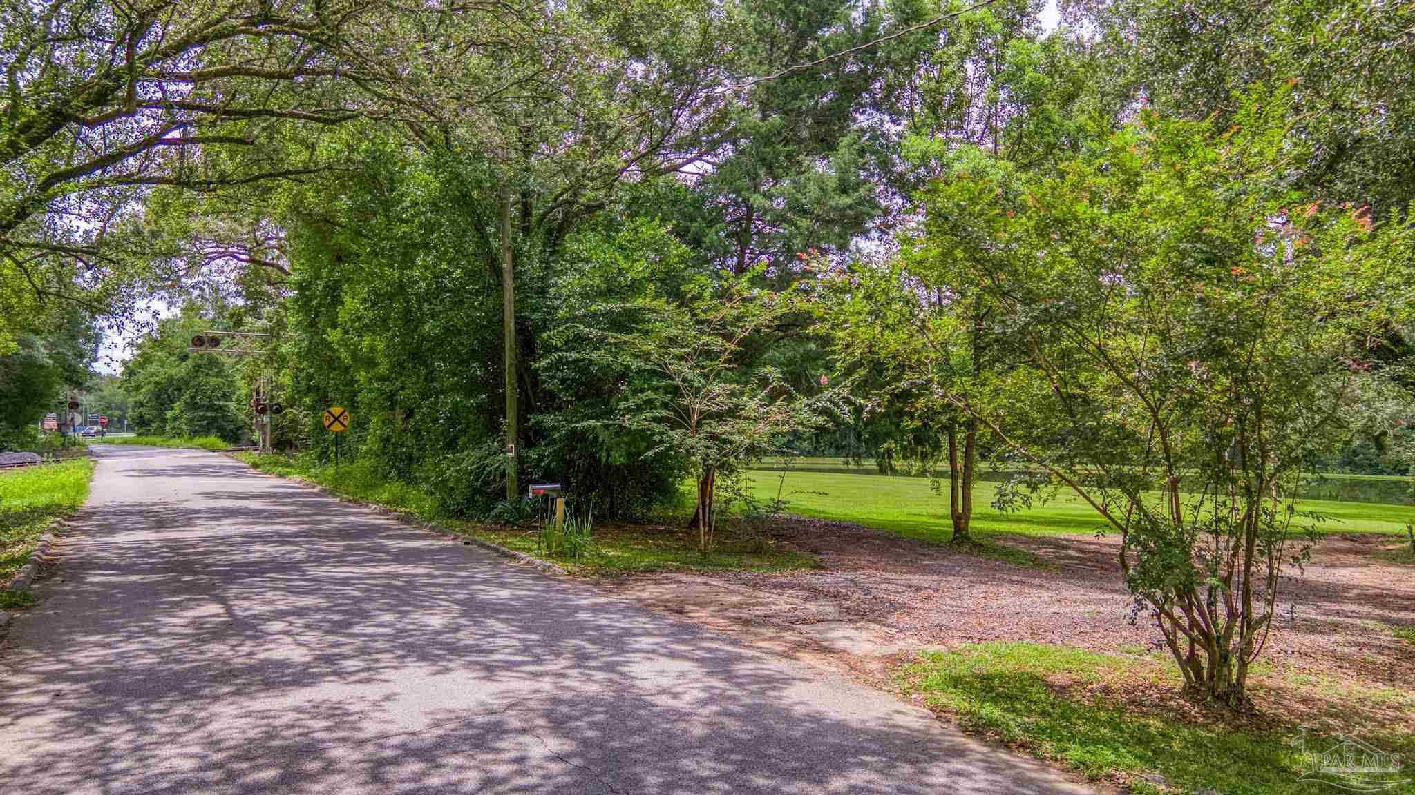 2345 Pompano Street Cantonment, FL 32533 - Photo 46 of 48 a view of a park with large trees