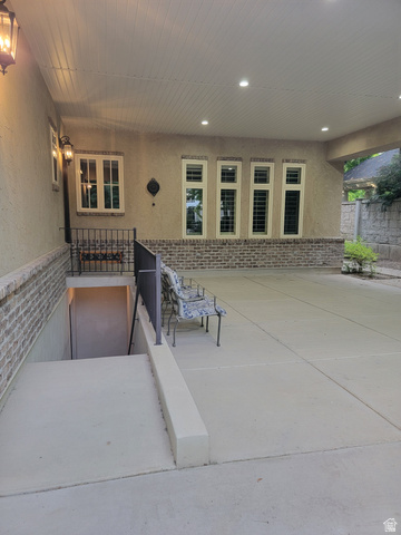 650 East Center Street Alpine, UT 84004 - Photo 32 of 38 Covered outdoor patio area, also featuring a covered basement entrance