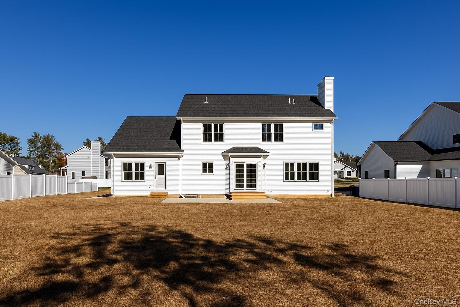 12 Fox Run Court Ridge, NY 11961 - Photo 4 of 11 a front view of a house with a yard