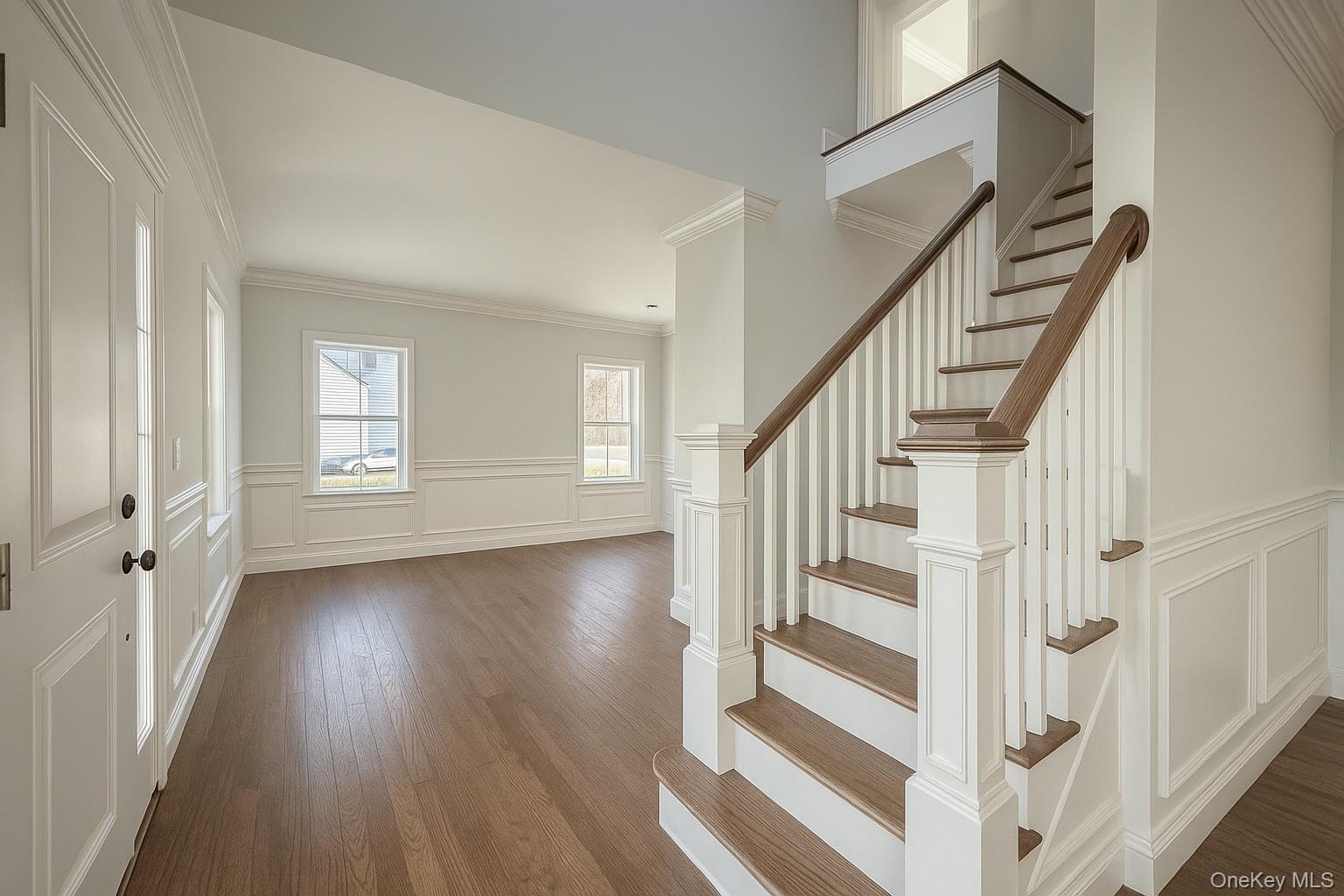 12 Fox Run Court Ridge, NY 11961 - Photo 6 of 11 a view of an entryway with wooden floor and door