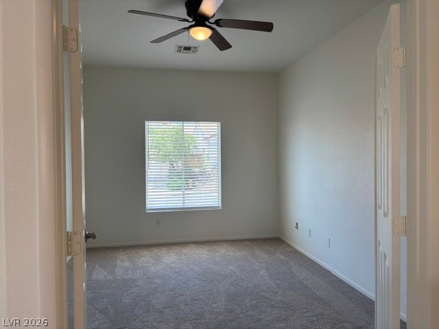 2866 Shimmering Bay Street Laughlin, NV 89029 - Photo 22 of 32 A well-lit bedroom features plush carpeting and a modern ceiling fan, offering a comfortable personal retreat.