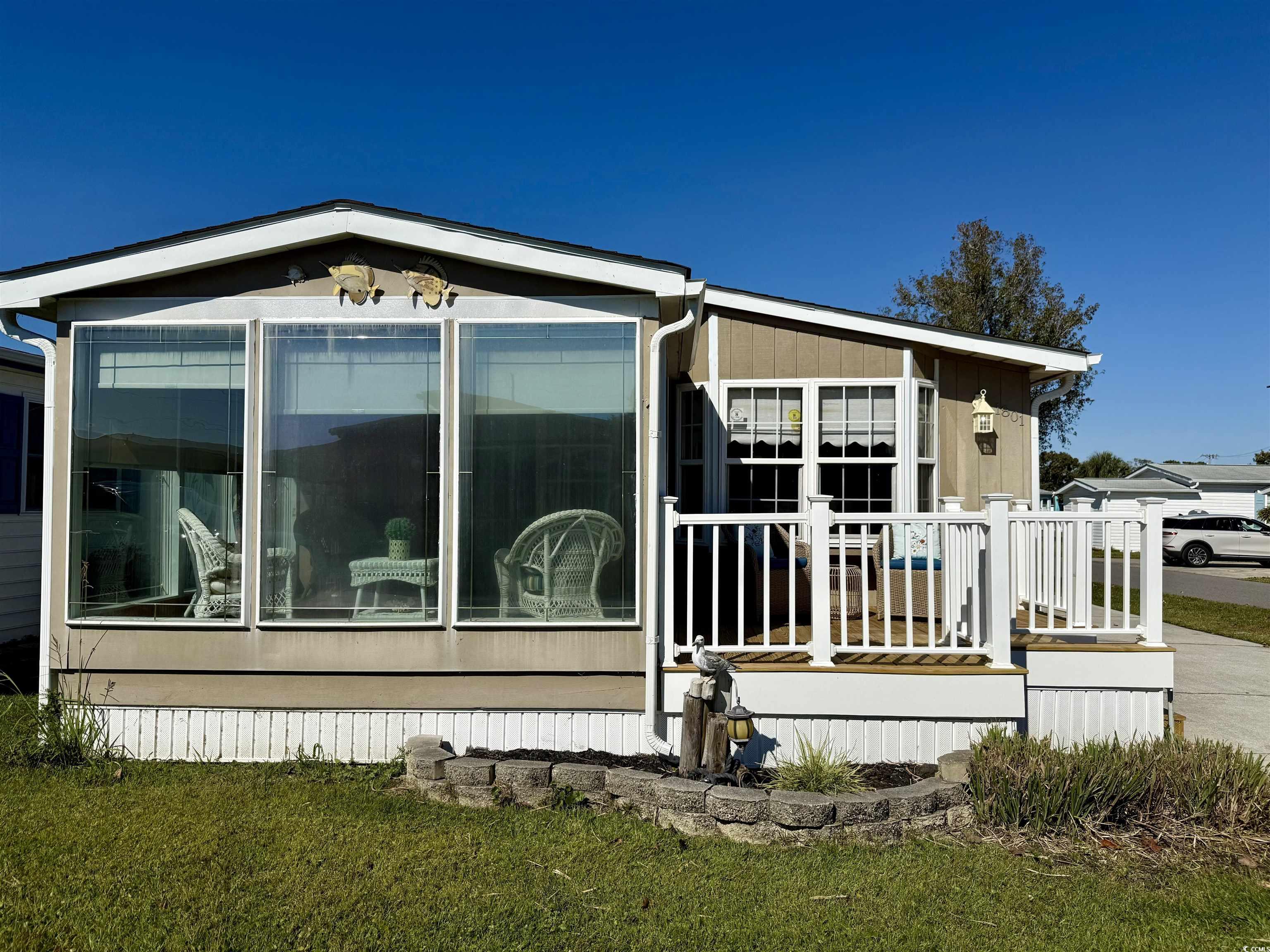 1801 E Lake Surfside Beach, SC 29575 - Photo 1 of 32 View of home's exterior with a lawn