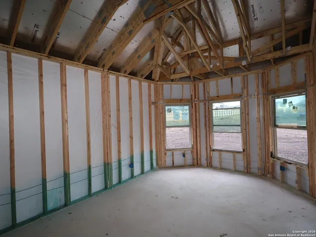 a view of an empty room with wooden walls
