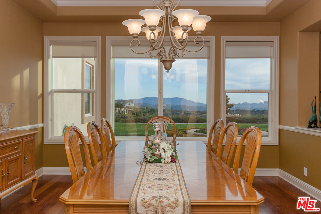 12090 Nelson Road Moorpark, CA 93021 - Photo 2 of 54 a view of a dining room with furniture wooden floor and chandelier