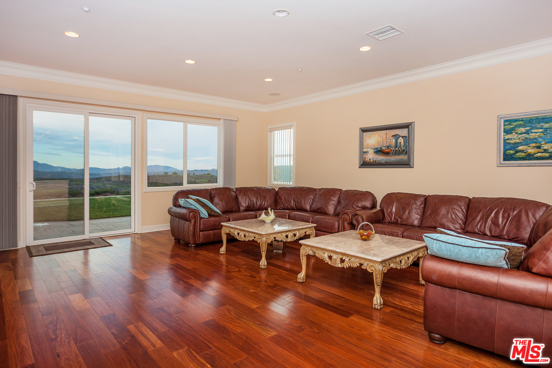 12090 Nelson Road Moorpark, CA 93021 - Photo 12 of 54 a living room with furniture and a large window