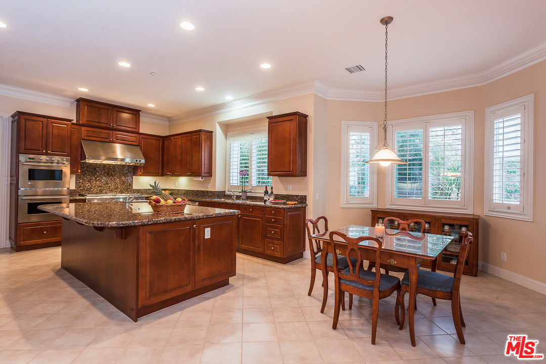 12090 Nelson Road Moorpark, CA 93021 - Photo 15 of 54 a large kitchen with kitchen island a large island in it