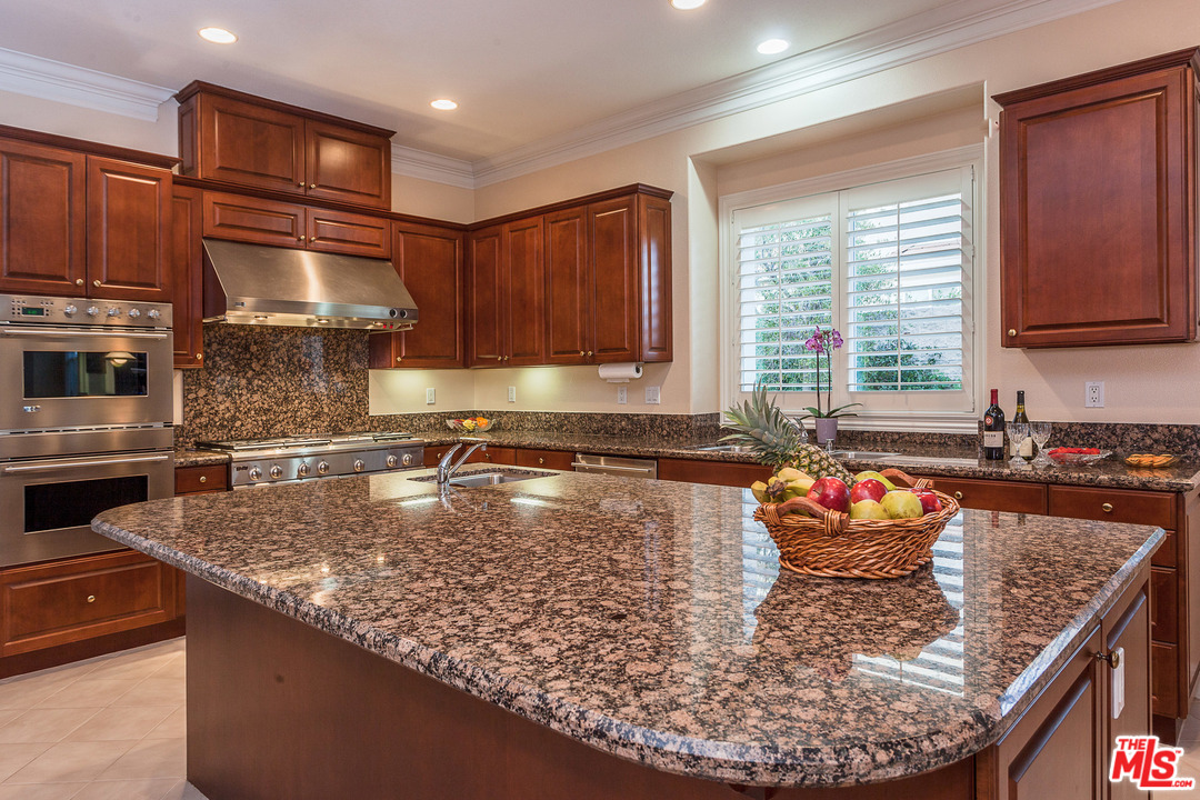 12090 Nelson Road Moorpark, CA 93021 - Photo 17 of 54 a kitchen with a stove a sink and a refrigerator