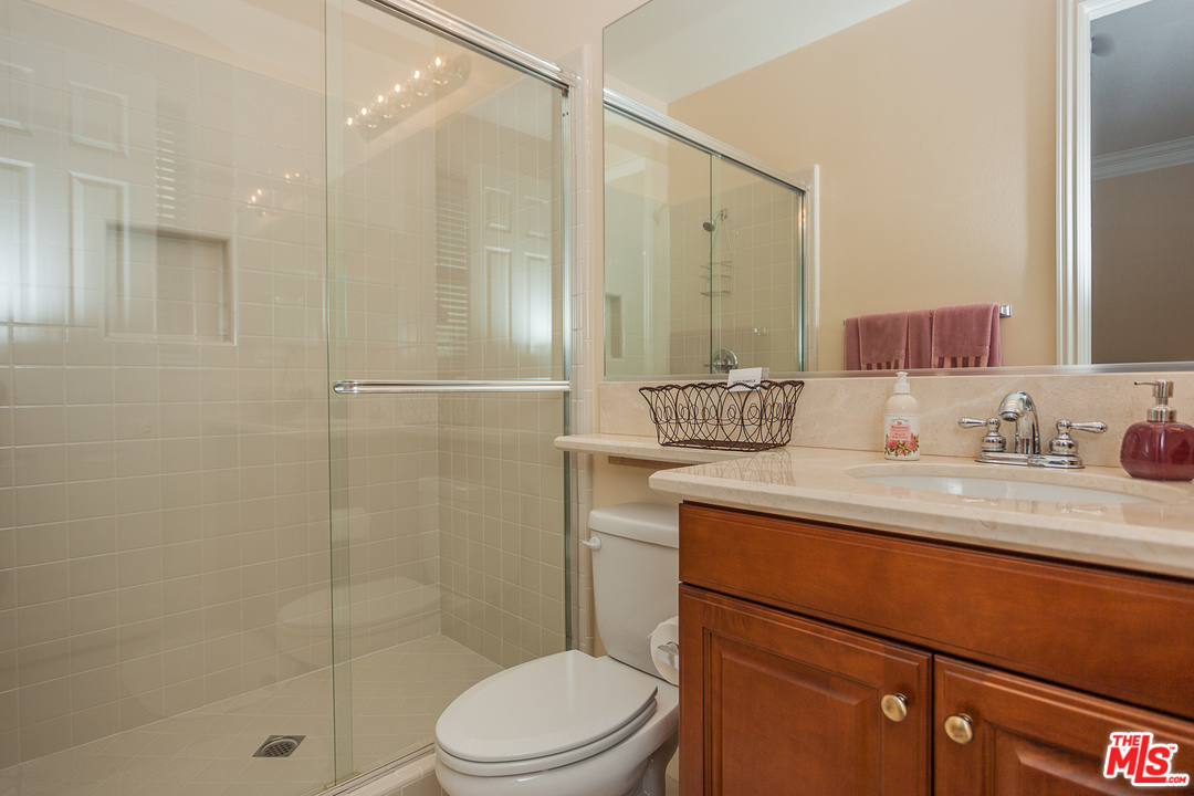 12090 Nelson Road Moorpark, CA 93021 - Photo 21 of 54 a bathroom with a sink a toilet and shower