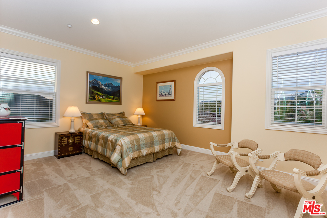 12090 Nelson Road Moorpark, CA 93021 - Photo 26 of 54 a spacious bedroom with a bed and glass windows