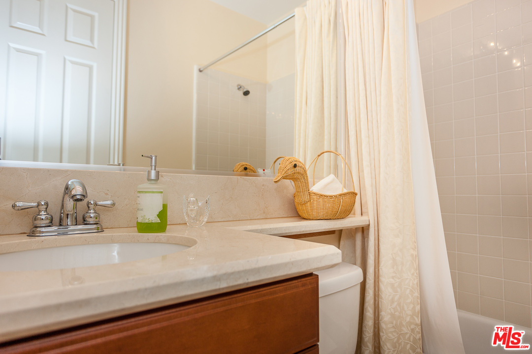 12090 Nelson Road Moorpark, CA 93021 - Photo 27 of 54 a bathroom with a sink and a mirror