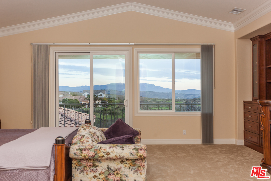 12090 Nelson Road Moorpark, CA 93021 - Photo 30 of 54 a living room with a bed and a window