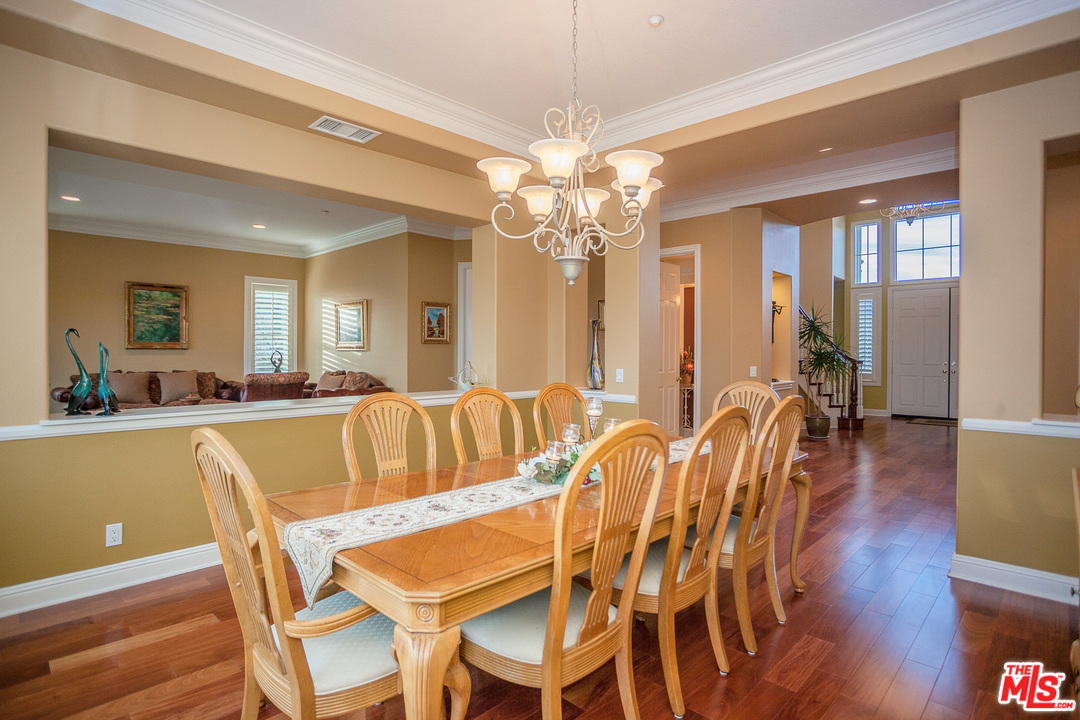 12090 Nelson Road Moorpark, CA 93021 - Photo 4 of 54 a view of a dining room with furniture and wooden floor