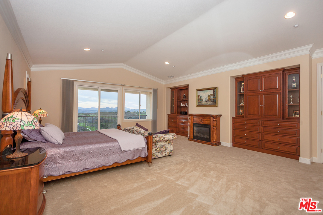 12090 Nelson Road Moorpark, CA 93021 - Photo 32 of 54 a spacious bedroom with a bed and a dresser