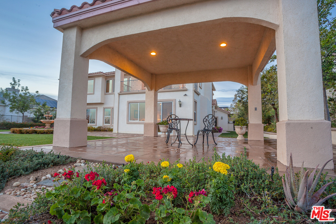 12090 Nelson Road Moorpark, CA 93021 - Photo 46 of 54 a view of a patio with table and chairs and potted plants