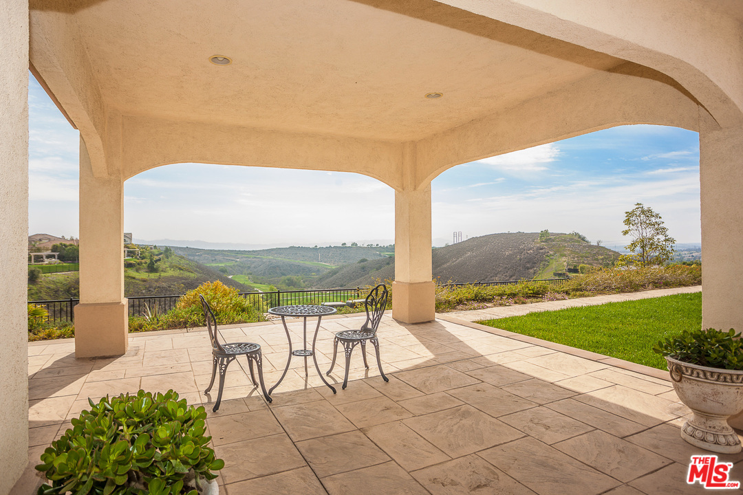 12090 Nelson Road Moorpark, CA 93021 - Photo 51 of 54 a view of swimming pool with a table and chairs under an umbrella