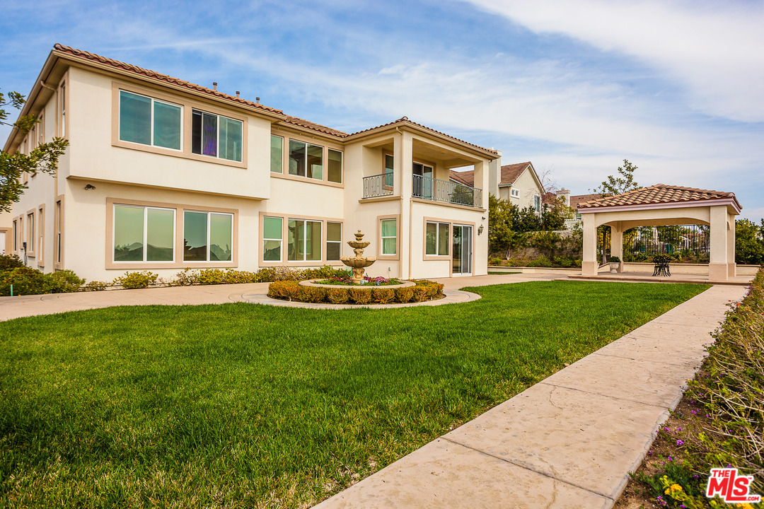 12090 Nelson Road Moorpark, CA 93021 - Photo 53 of 54 a front view of a house with a yard