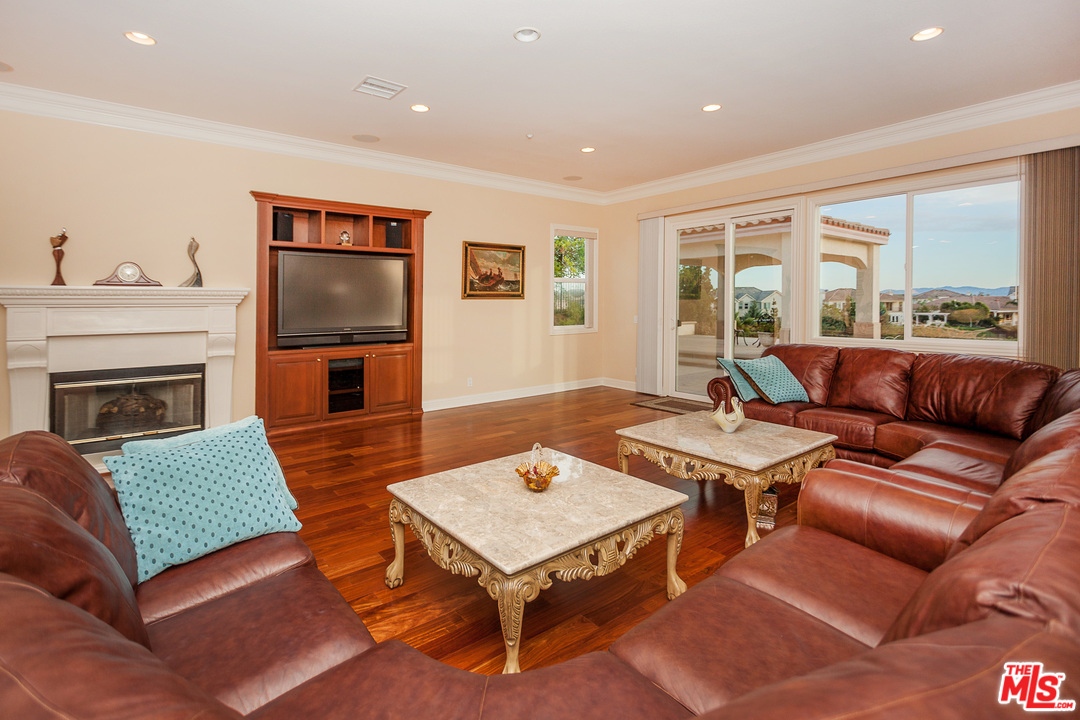 12090 Nelson Road Moorpark, CA 93021 - Photo 10 of 54 a living room with furniture and a fireplace
