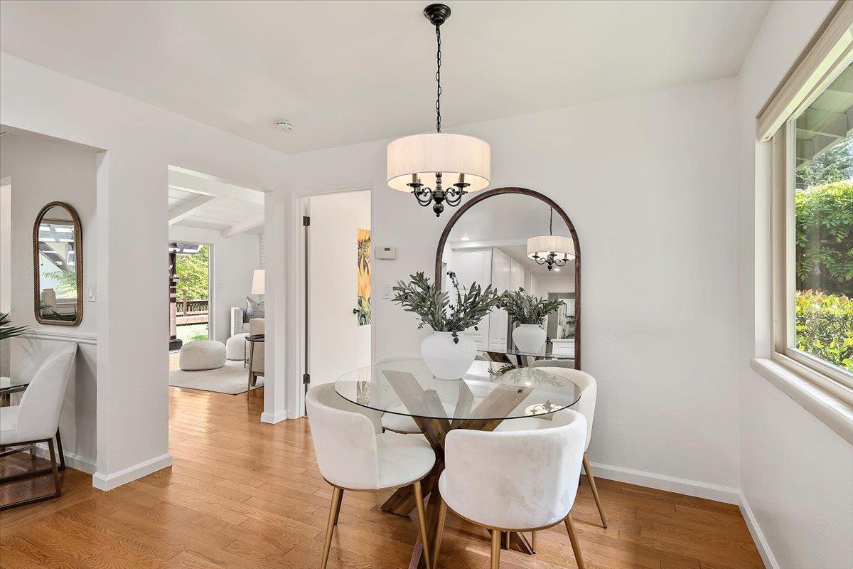 216 Montclair Road Los Gatos, CA 95032 - Photo 11 of 44 a view of a dining room with furniture window and wooden floor