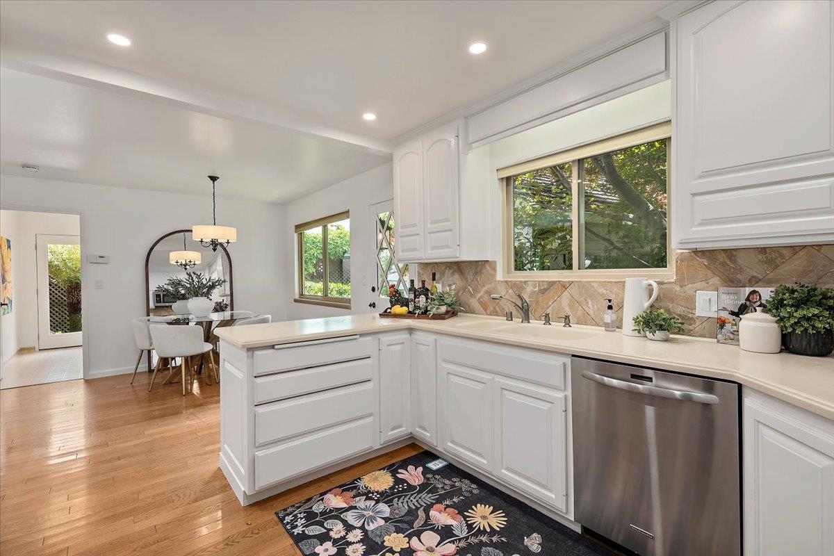 216 Montclair Road Los Gatos, CA 95032 - Photo 12 of 44 a kitchen that has a lot of cabinets a sink and appliances in it