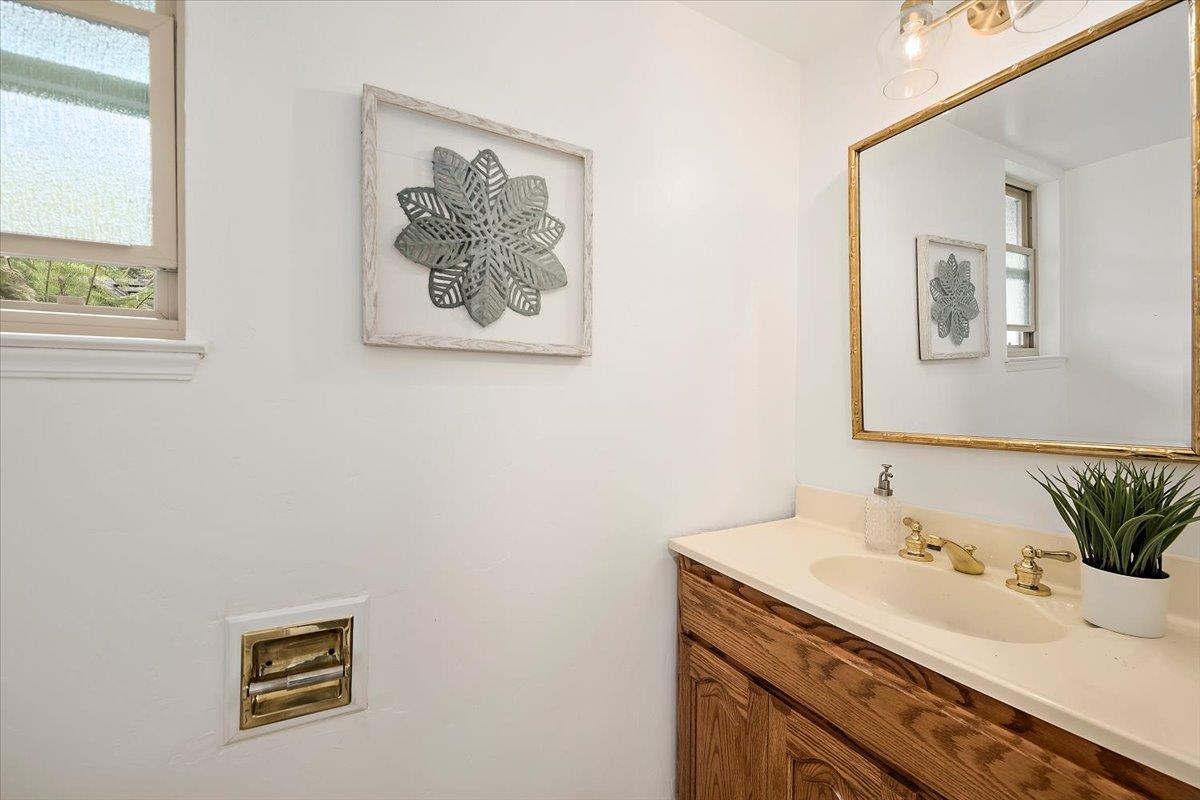216 Montclair Road Los Gatos, CA 95032 - Photo 16 of 44 a bathroom with a sink and a mirror