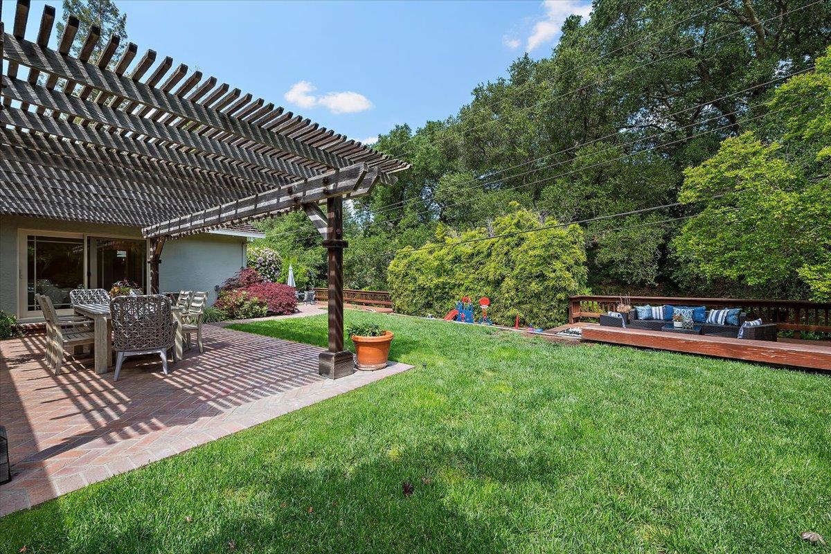 216 Montclair Road Los Gatos, CA 95032 - Photo 24 of 44 a view of a house with backyard and sitting area