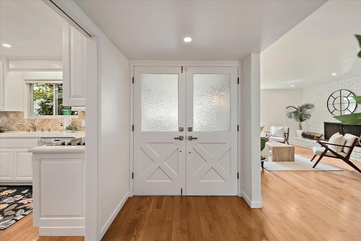 216 Montclair Road Los Gatos, CA 95032 - Photo 4 of 44 a view of an entryway with wooden floor and furniture